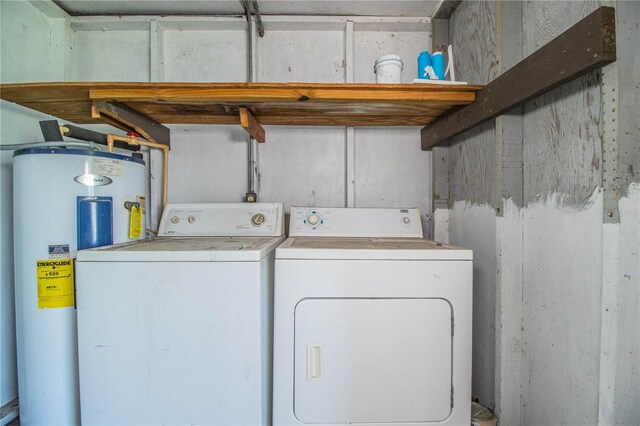 washroom featuring washer and dryer and water heater