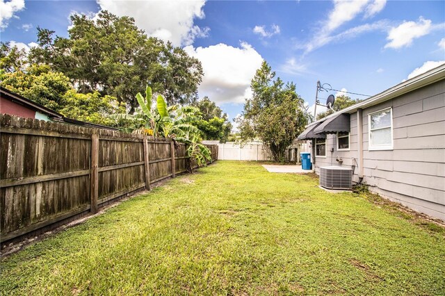 view of yard with central AC