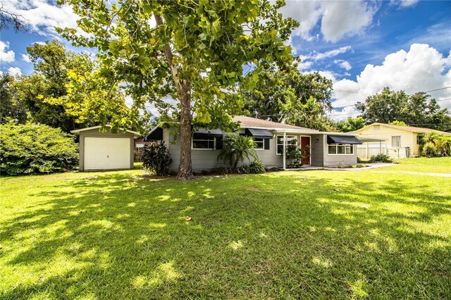 ranch-style house with a front lawn