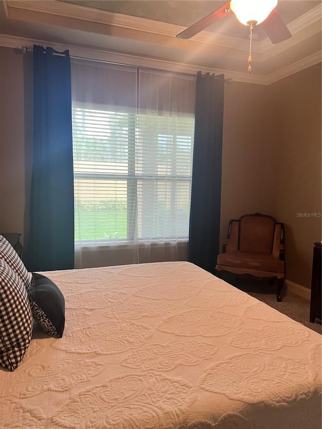 bedroom with ceiling fan, carpet, and ornamental molding