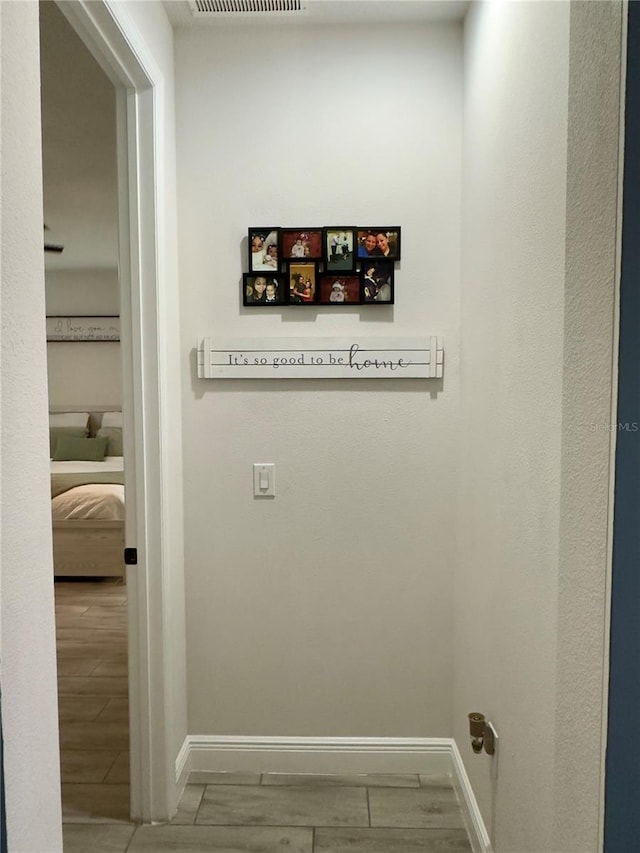 hallway featuring wood-type flooring