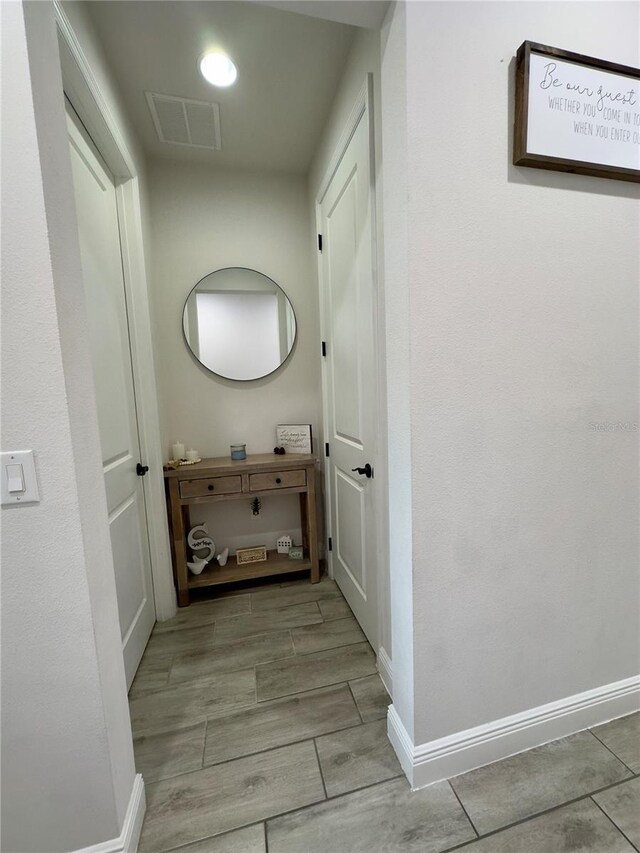 hall with light tile patterned flooring