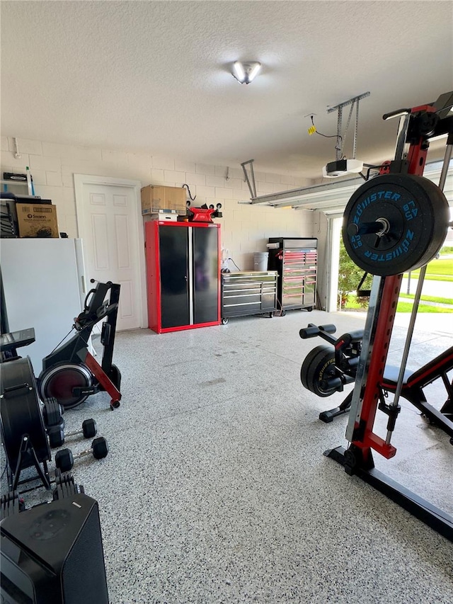 exercise room featuring a textured ceiling