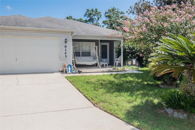 exterior space with a garage and a front yard