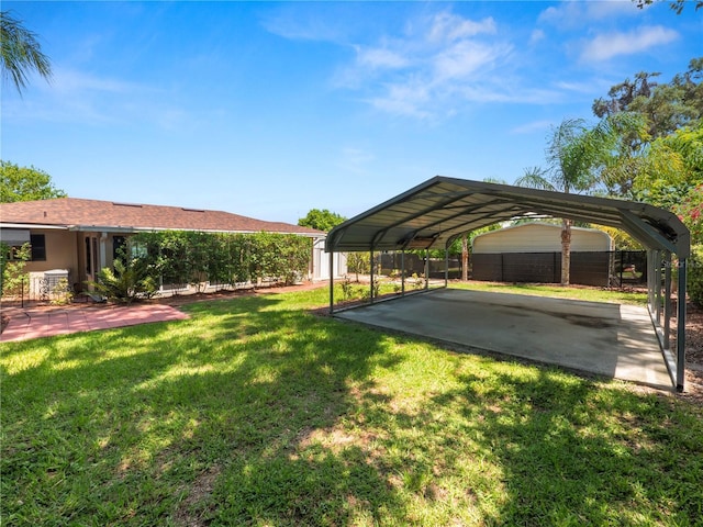 view of parking featuring a carport and a lawn