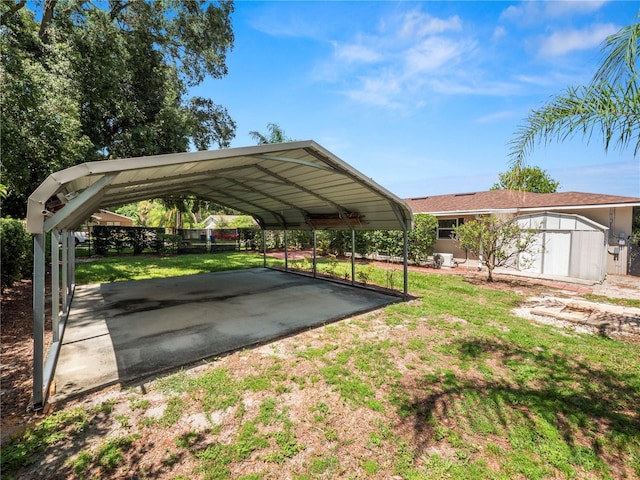 view of parking / parking lot with a lawn and a carport