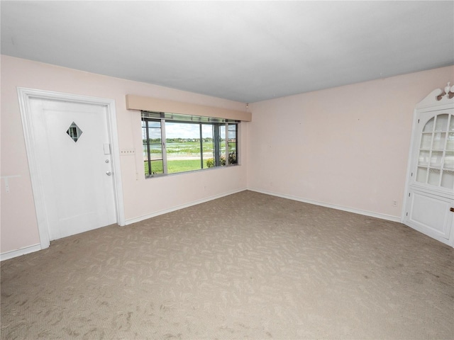 view of carpeted entrance foyer