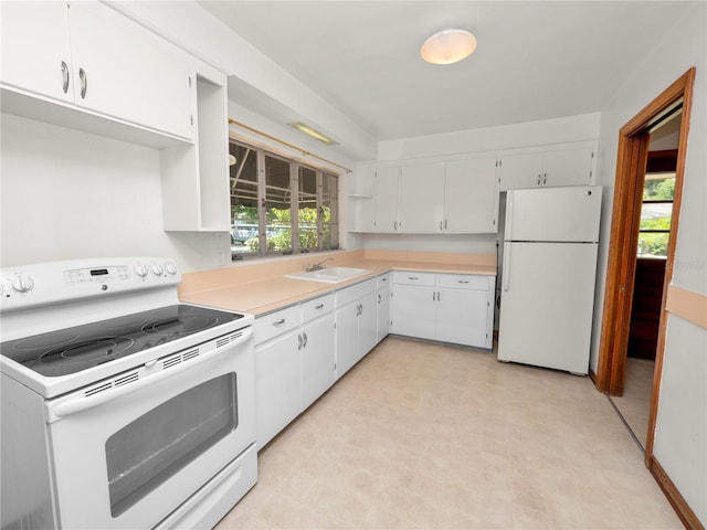 kitchen featuring white cabinets, white appliances, and sink