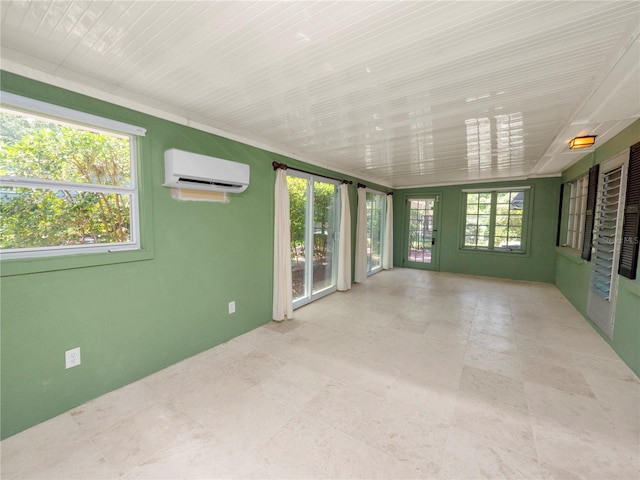 unfurnished sunroom featuring a wall unit AC