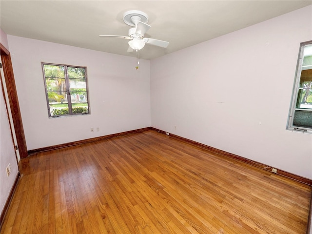 unfurnished room with light hardwood / wood-style flooring and ceiling fan