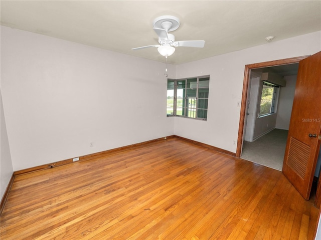 unfurnished room with light wood-type flooring and ceiling fan