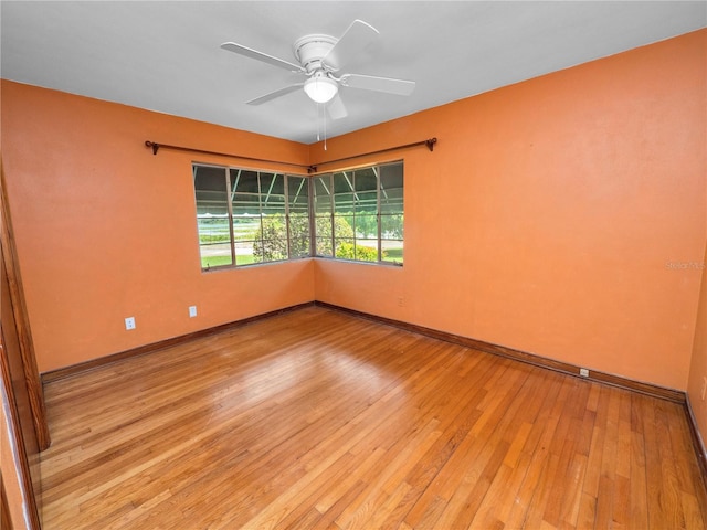 unfurnished room featuring ceiling fan and light hardwood / wood-style floors