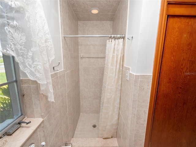 bathroom featuring a shower with curtain