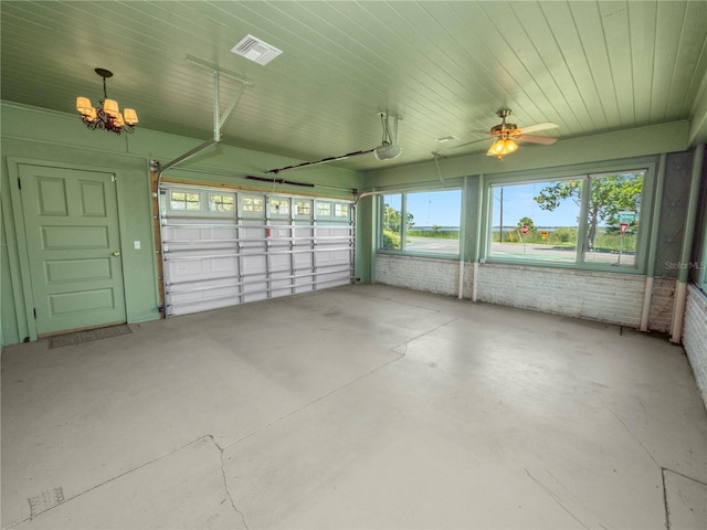 garage with ceiling fan and a garage door opener