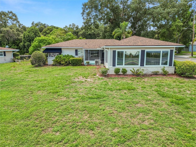 single story home featuring a front yard