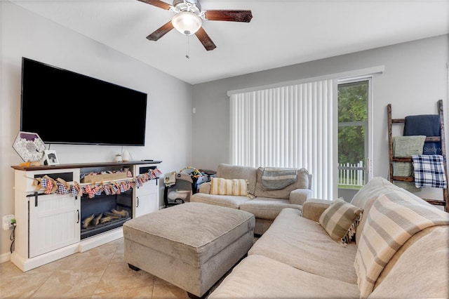 living room with light tile patterned flooring and ceiling fan