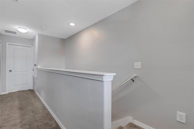 hallway featuring carpet flooring