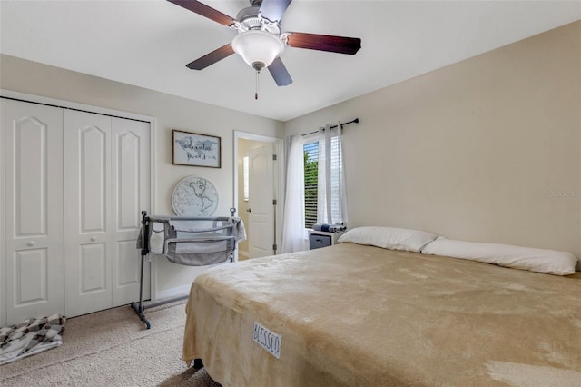 bedroom with carpet, a closet, and ceiling fan