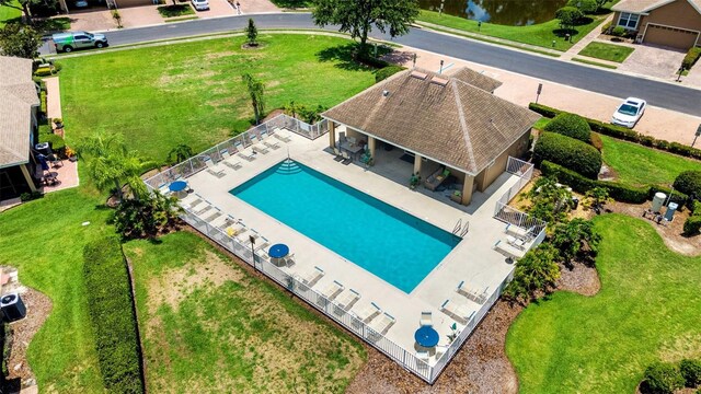 view of pool with a yard and a patio area