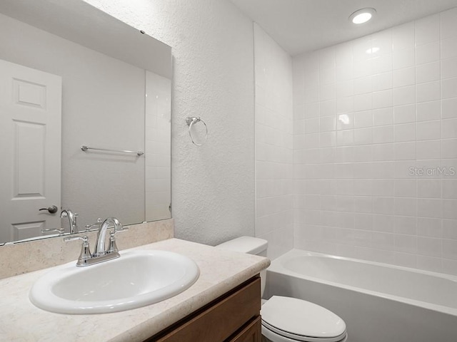 full bathroom featuring vanity, toilet, and tub / shower combination