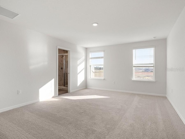 empty room with light colored carpet