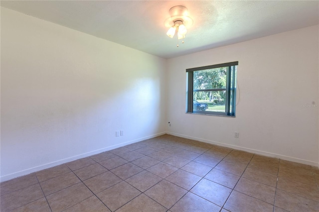 unfurnished room with light tile patterned floors