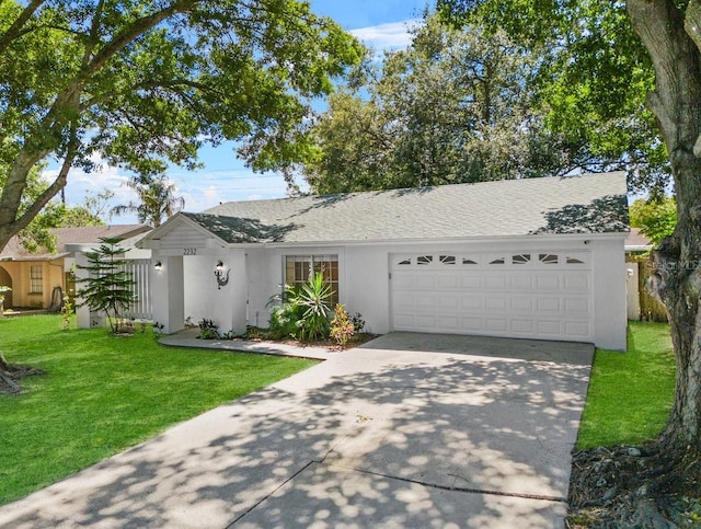 ranch-style home featuring a front yard and a garage