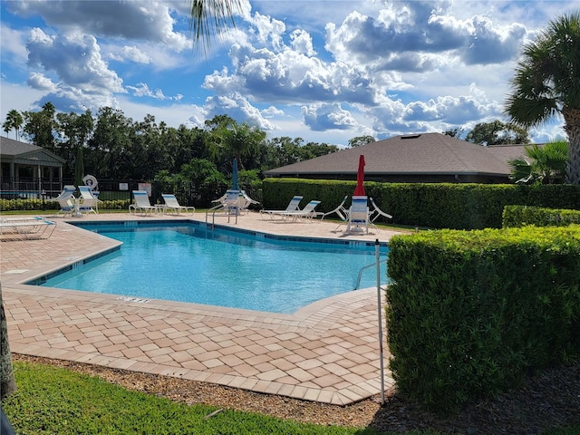 view of swimming pool featuring a patio area