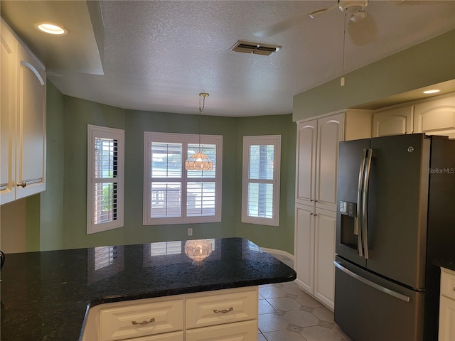 kitchen with white cabinetry and stainless steel refrigerator with ice dispenser