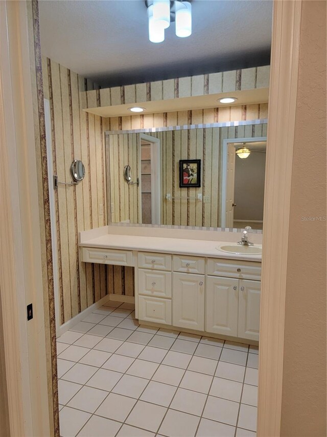 bathroom with tile patterned flooring and vanity