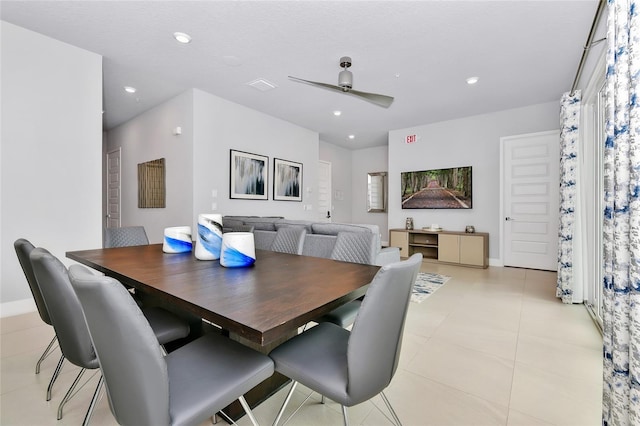 tiled dining room featuring ceiling fan