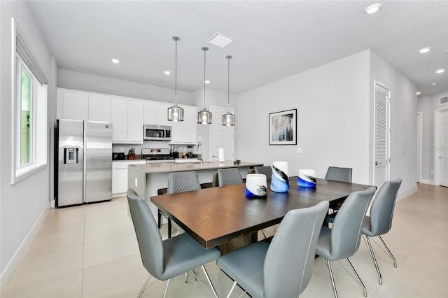 tiled dining space with sink