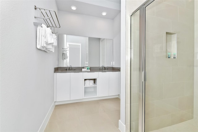 bathroom featuring vanity and a shower with shower door