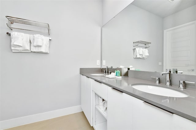 bathroom featuring tile patterned flooring and vanity