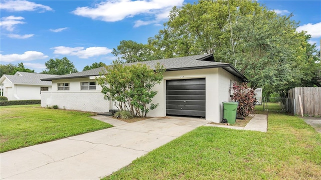 ranch-style house with a front lawn and a garage