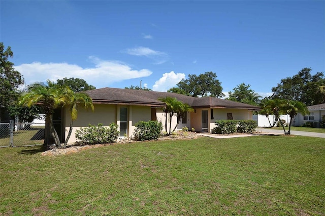 ranch-style house with a front yard