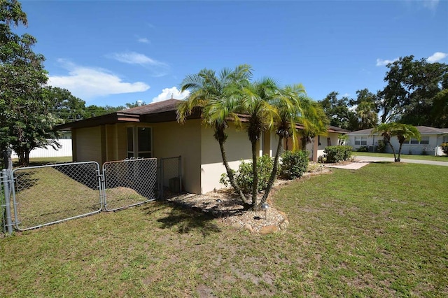 view of property exterior with a yard