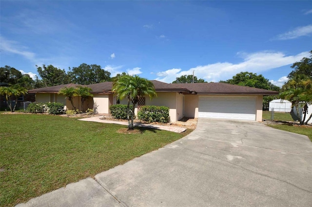 ranch-style house with a front lawn and a garage