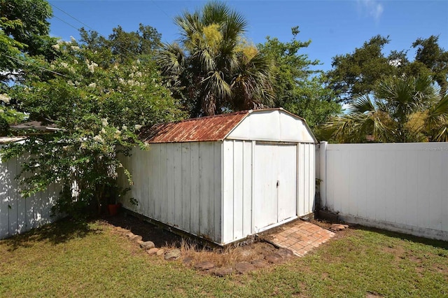 view of outbuilding with a lawn