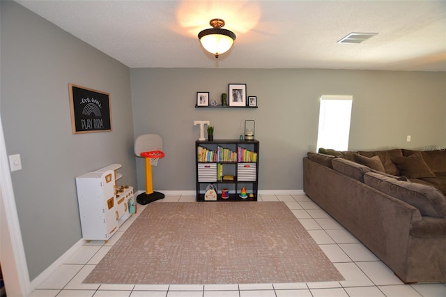 game room with light tile patterned floors