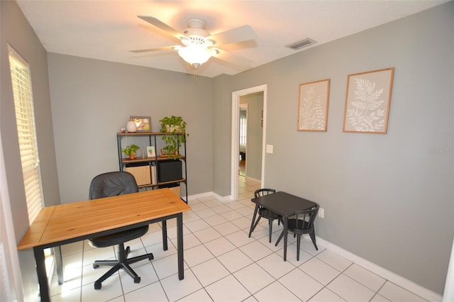 tiled home office with ceiling fan