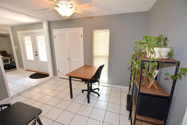 tiled office space featuring french doors, a wealth of natural light, and ceiling fan