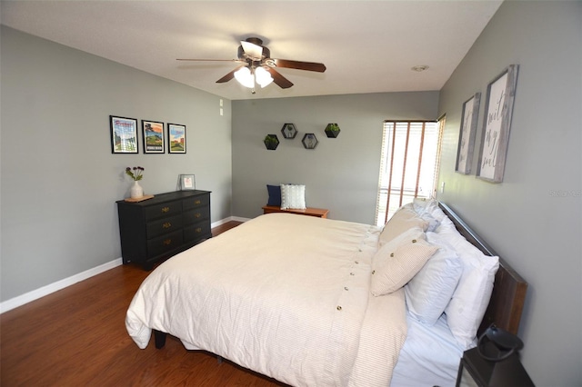 bedroom with dark hardwood / wood-style floors and ceiling fan