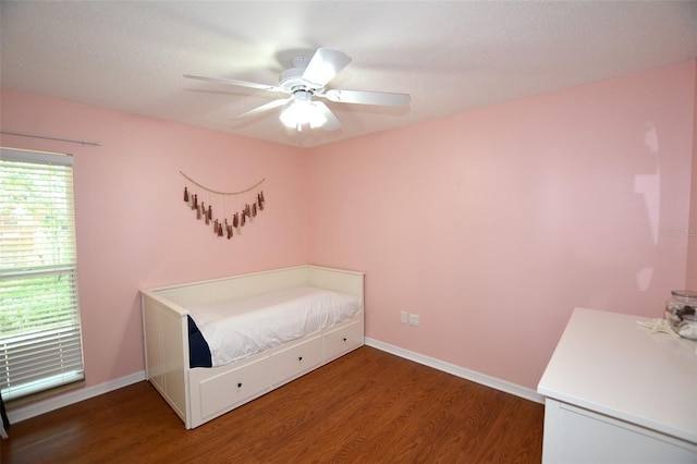 bedroom featuring dark hardwood / wood-style floors and ceiling fan