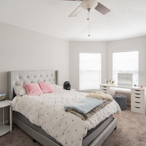 bedroom featuring carpet flooring and ceiling fan