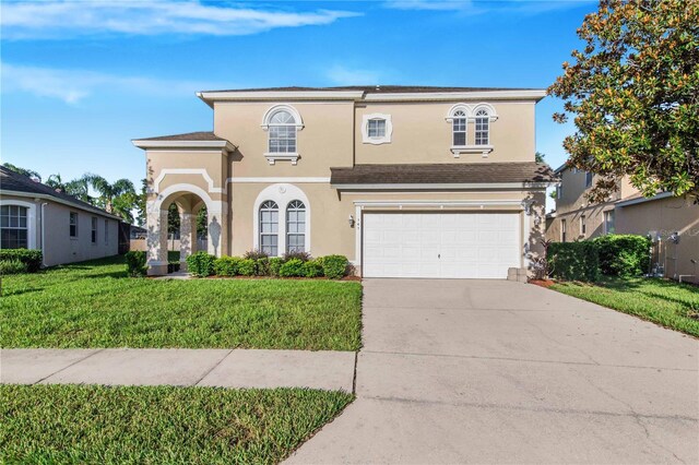 view of front of house featuring a garage and a front yard