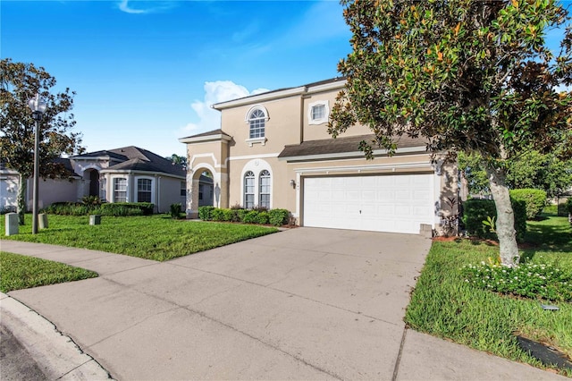 view of front facade with a garage and a front lawn