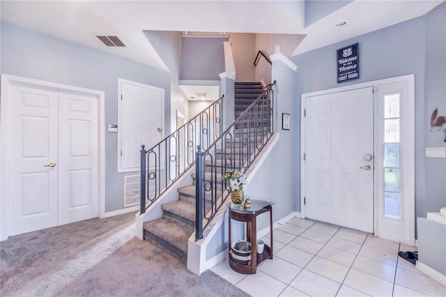 view of carpeted entrance foyer