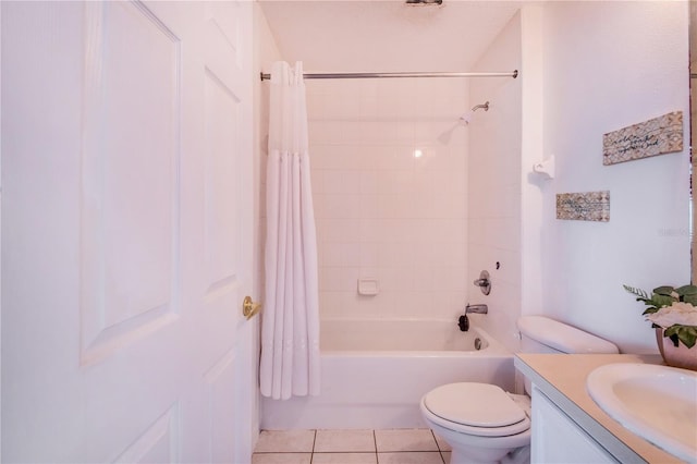 full bathroom with tile patterned floors, vanity, shower / tub combo with curtain, and toilet