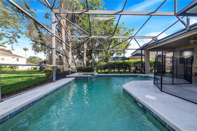 view of pool with a yard, a lanai, and a patio area